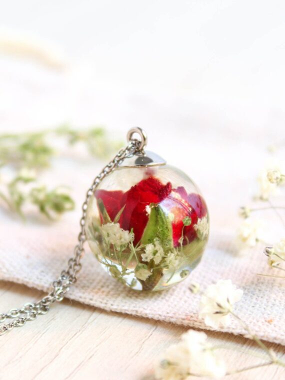 Elegant resin necklace with dried, factory real flower inside.