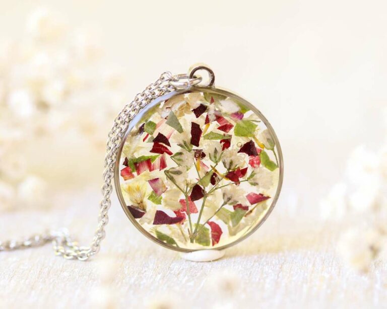 Custom memorial pendant made with preserved flower petals from a funeral bouquet.