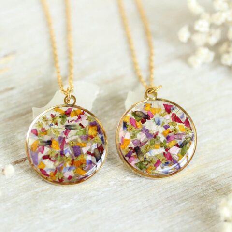 Necklace with preserved wedding bouquet flowers in resin pendant