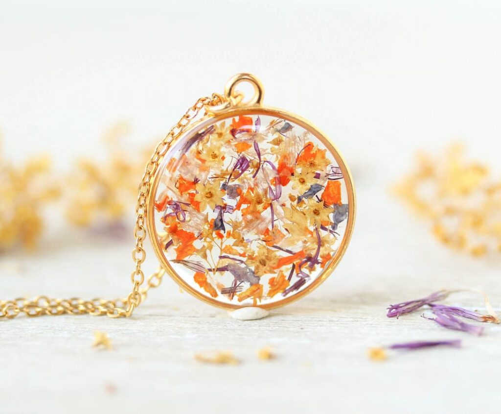 Handmade round necklace with preserved wedding bouquet flowers in resin, custom keepsake jewelry