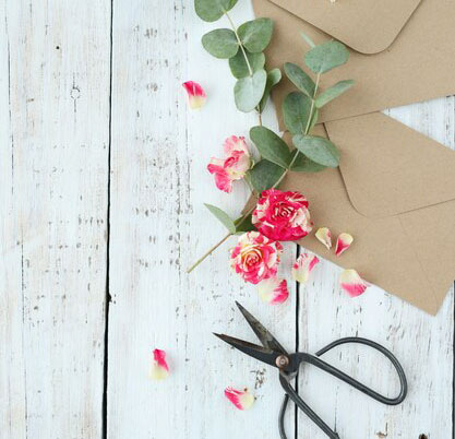 Fresh flowers and greenery prepared for personalized bouquet preservation jewelry